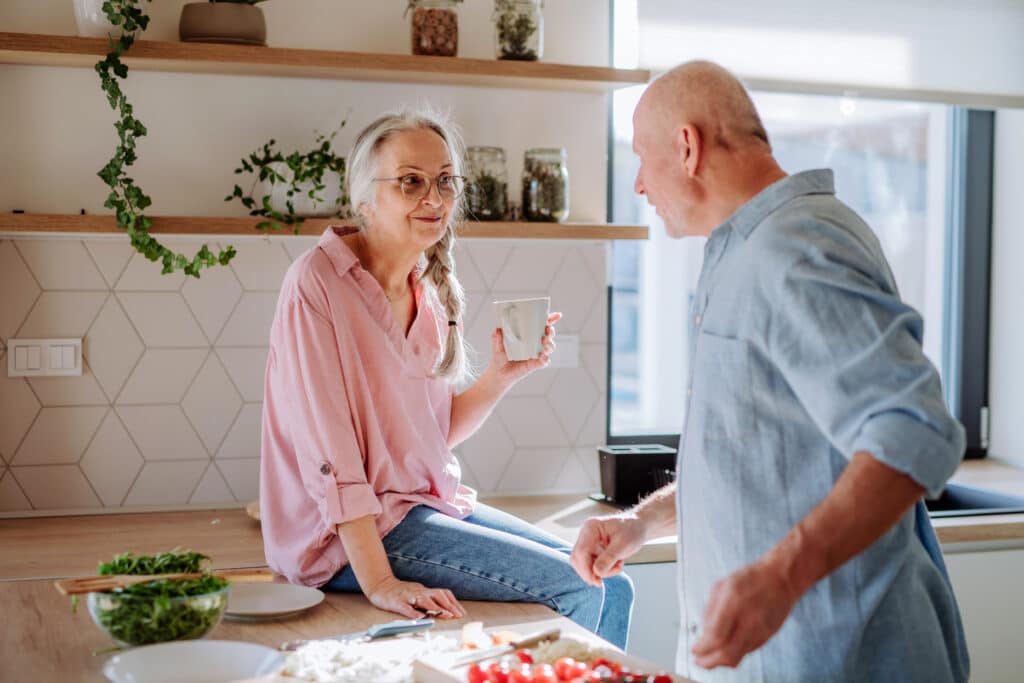 image of woman drinking water but needs iv hydration for senior wellness