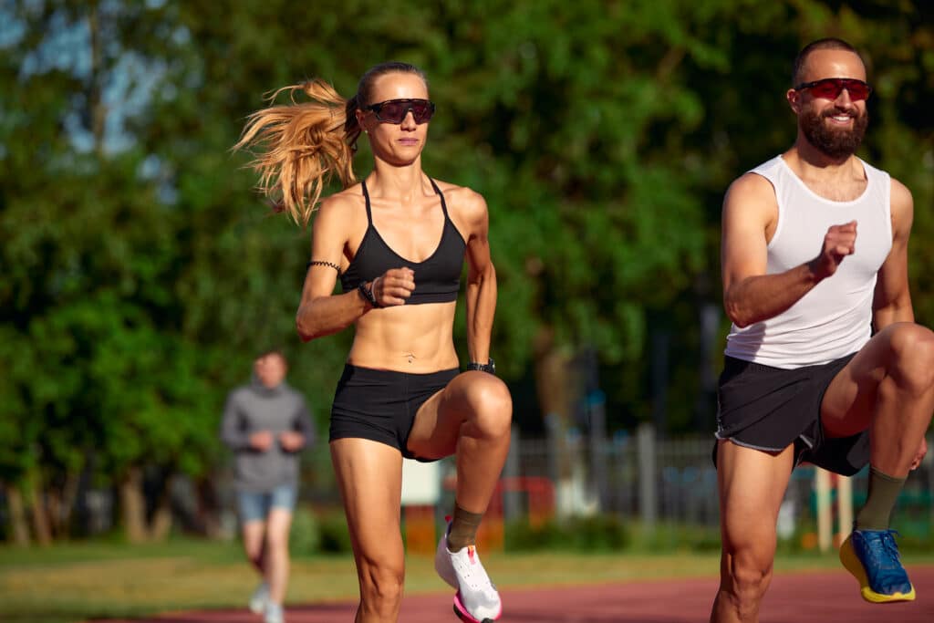 image of woman and man exercising after receiving iv hydration for athletes