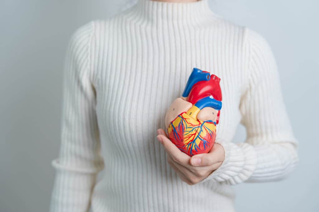 image of woman holding a heart as a concept for Health IV Hydration Therapy Benefits