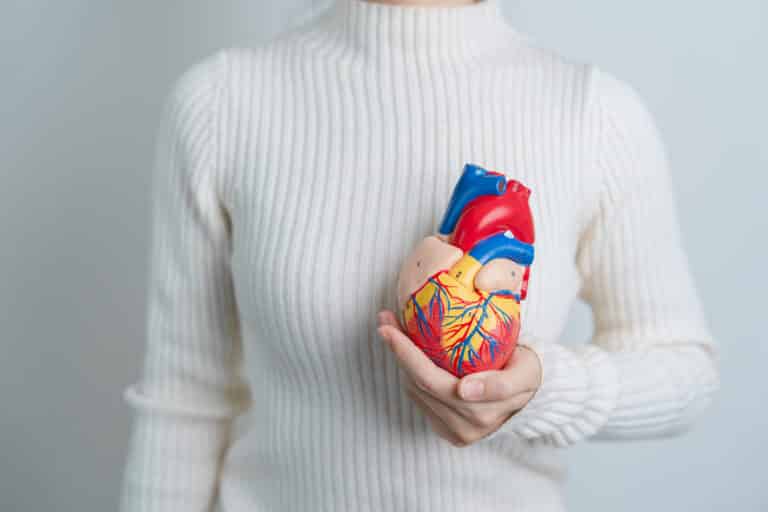 image of woman holding a heart as a concept for Health IV Hydration Therapy Benefits